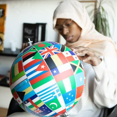 morgan-student-with-globe-of-flags