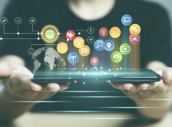 Person holding a smartphone with floating digital app icons and global tech network graphics, symbolizing innovative mobile app ideas