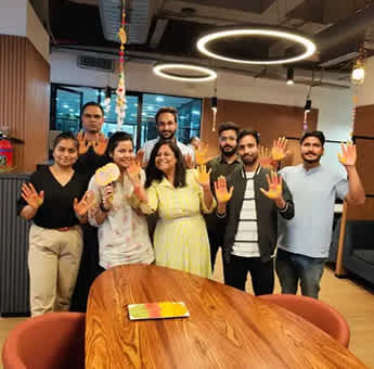 Digitup team celebrating a festive moment together at the office