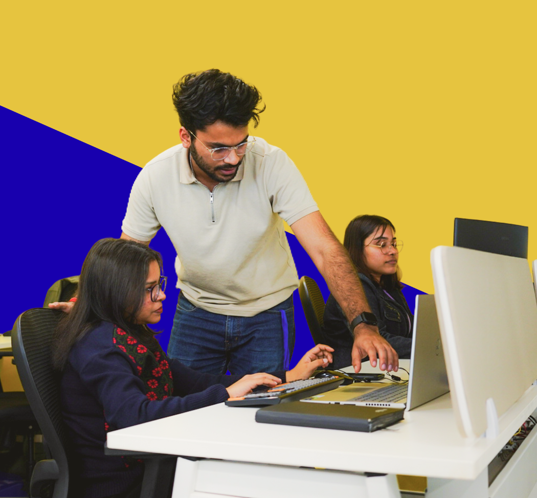 Digitup team collaborating at a workstation, illustrating trust, transparency, and a supportive work environment