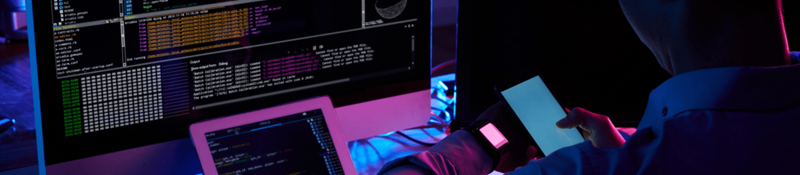 Developer working late at a desk with multiple screens and code displayed, symbolizing app development expertise in India