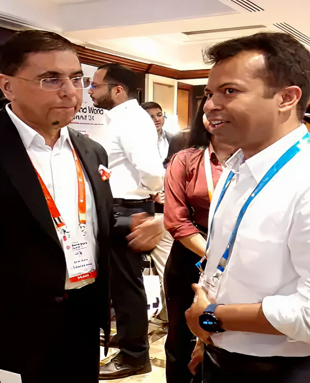 Digitup team members engaging in professional discussions at a technology and AI-focused industry event, showcasing leadership presence and networking activity 
