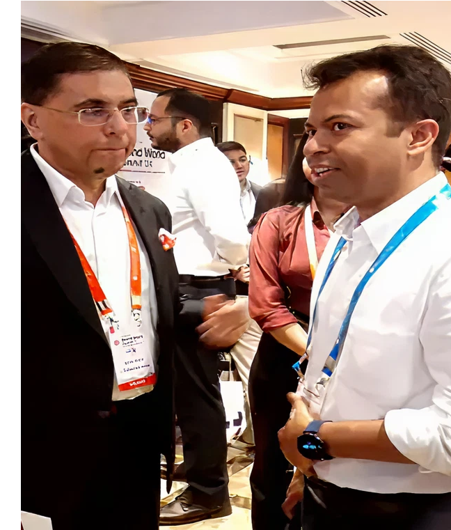 Digitup team members engaging in professional discussions at a technology and AI-focused industry event, showcasing leadership presence and networking activity
