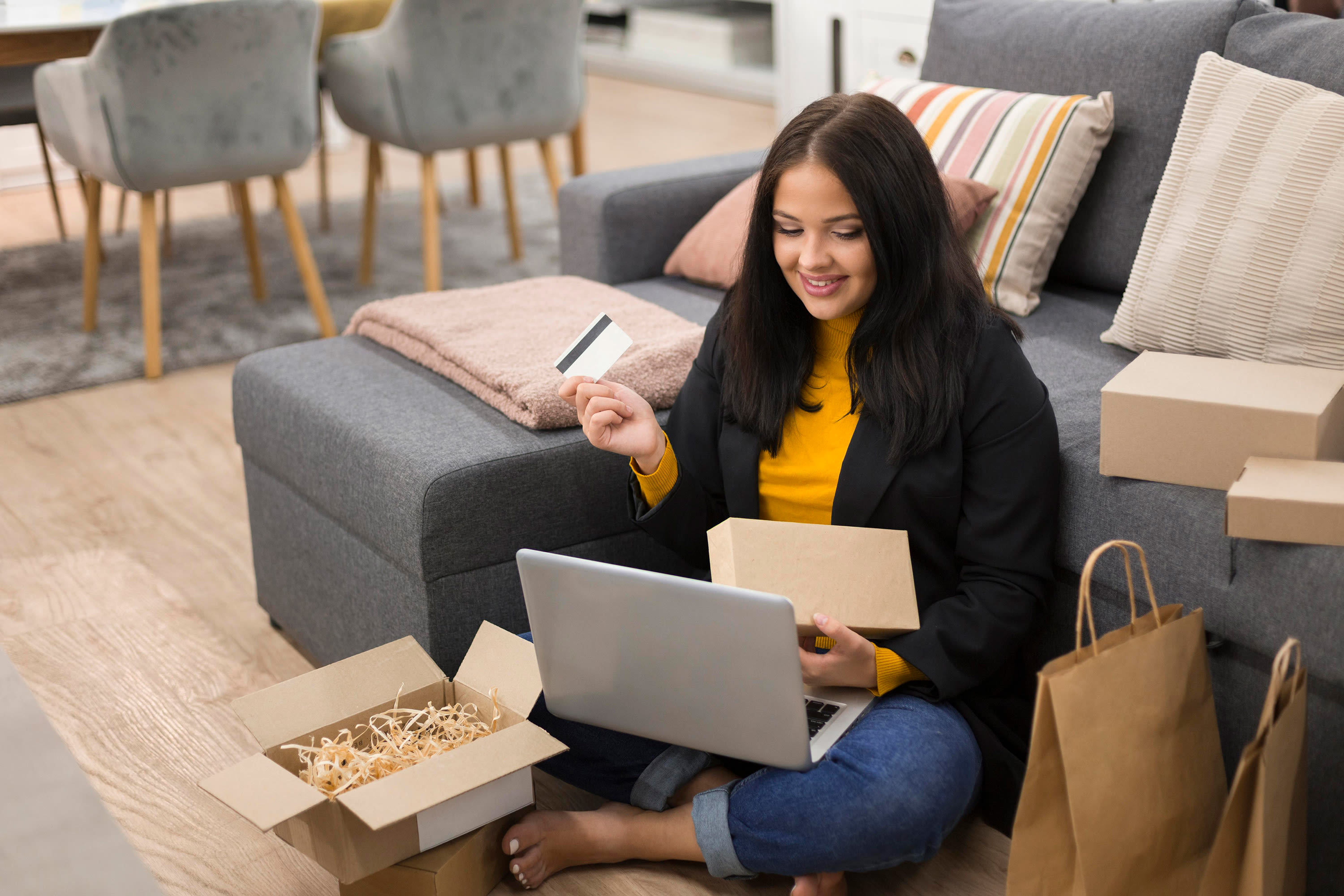 woman-sitting-floor-while-making-new-purchase2