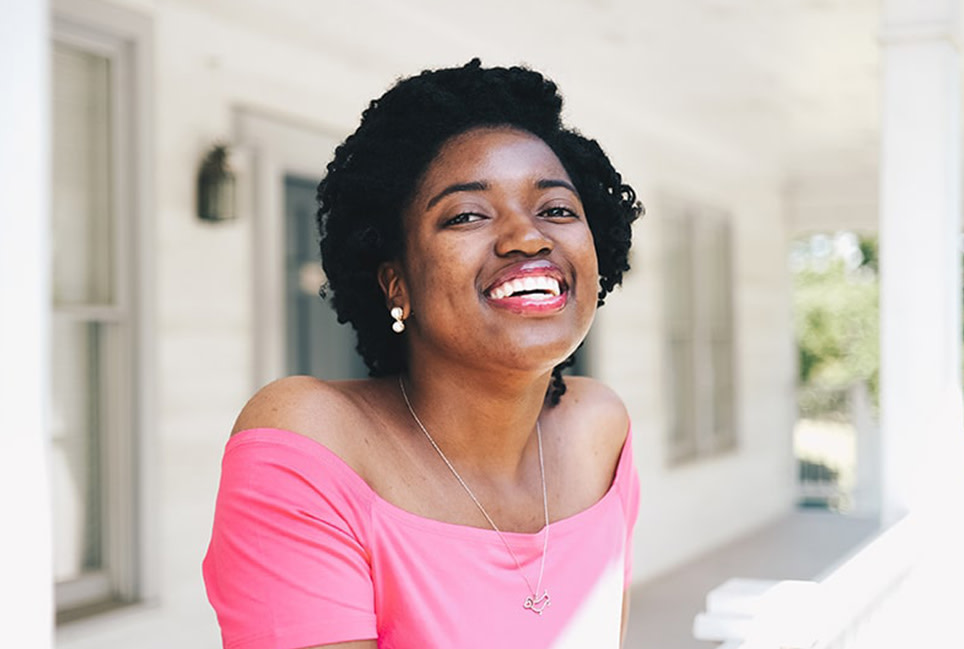 Woman smiling with short curly hair