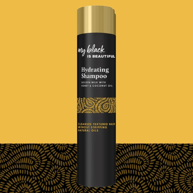 Golden Milk Hydrating Shampoo bottle with pattern in the background
