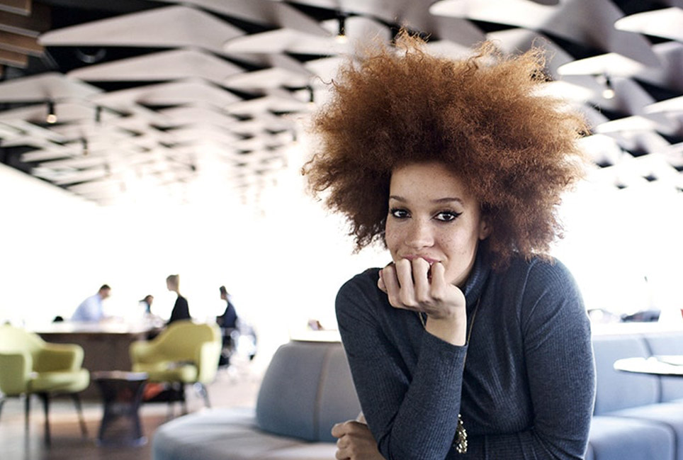 Woman looking pensive in an office