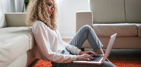 Image of girl on laptop searching for broadband