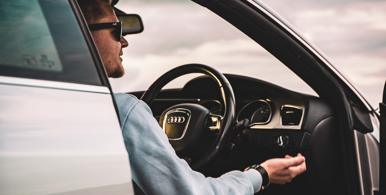 Person sat in driving seat of car