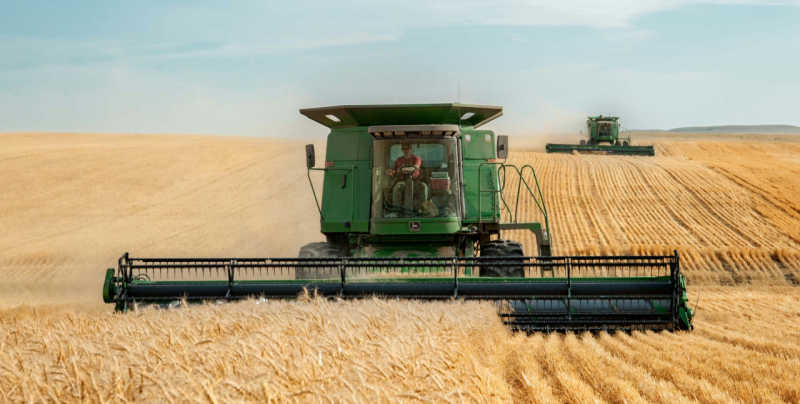 Image of a tractors ploughing a field