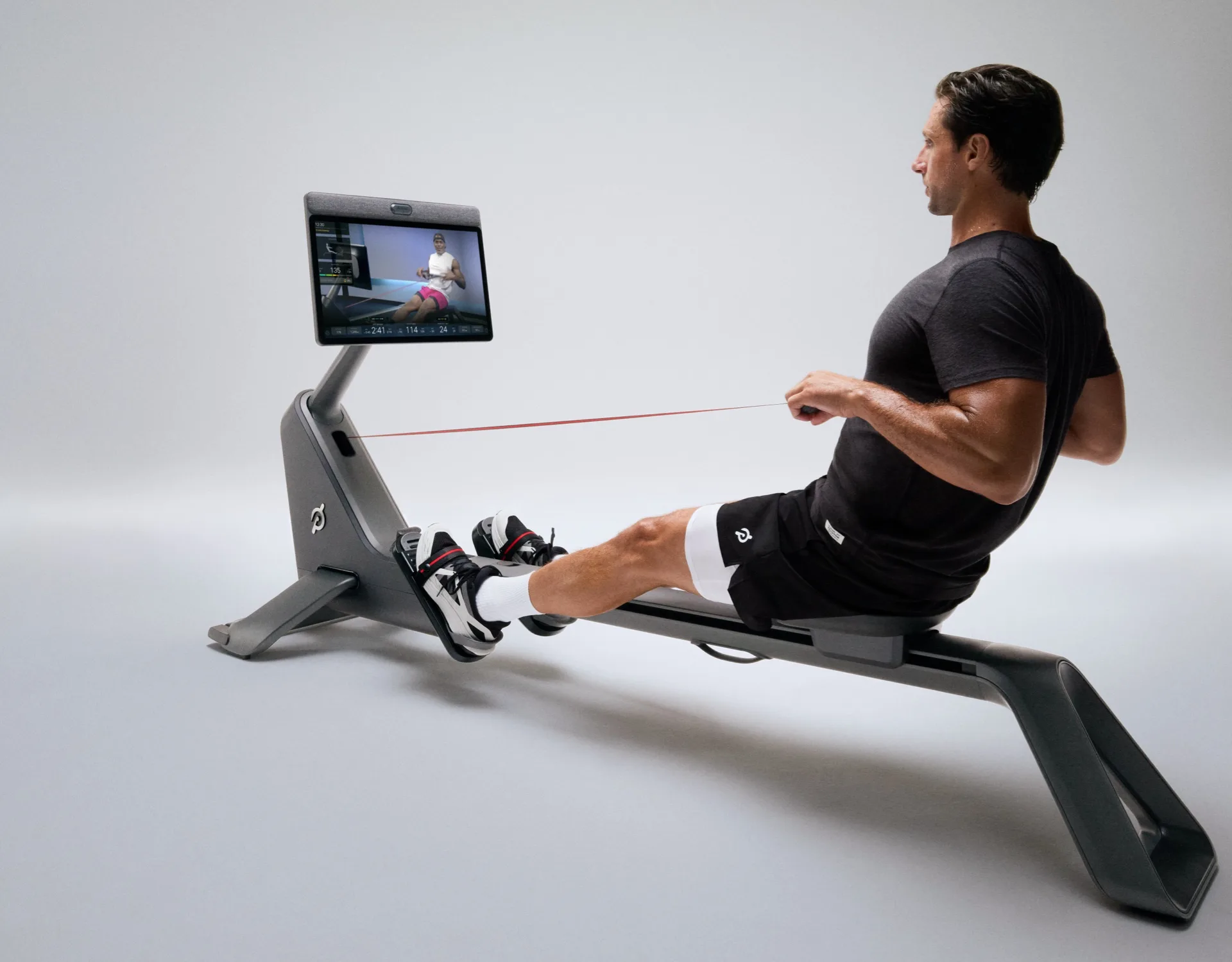 An exerciser using a Peloton Row+ Pro