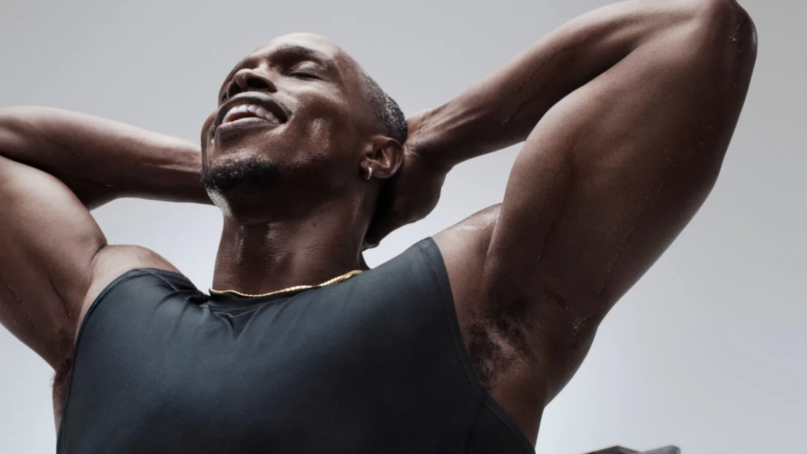 Close-up of a man, sweaty but relieved, after a workout.