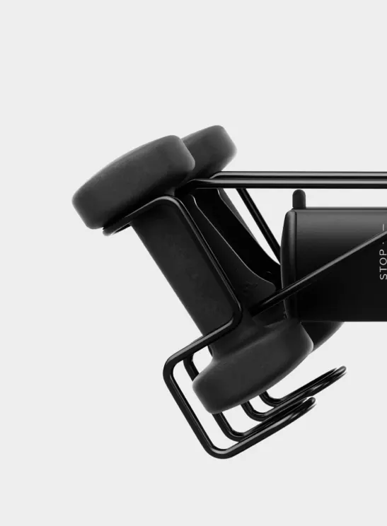 Close-up of the wire weight holder on the back of the seat with weights in place.
