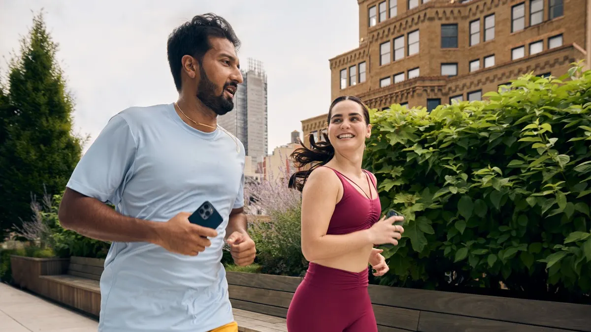 Peloton members using the Peloton App during an outdoor run exercise