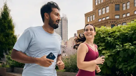 Two exerciser running outdoors in the city