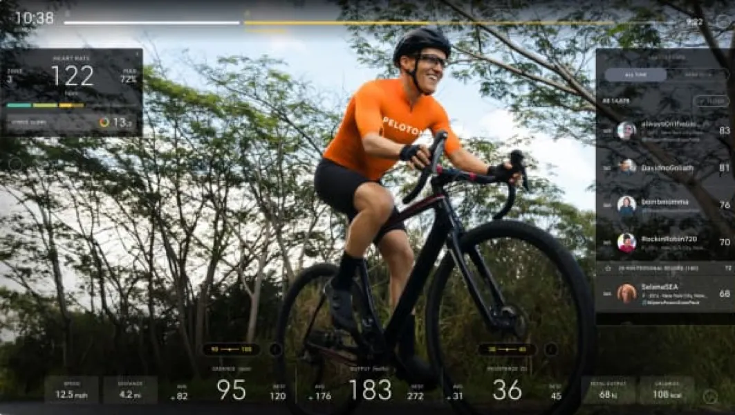 A man riding through a simulated scenic environment on a bike.