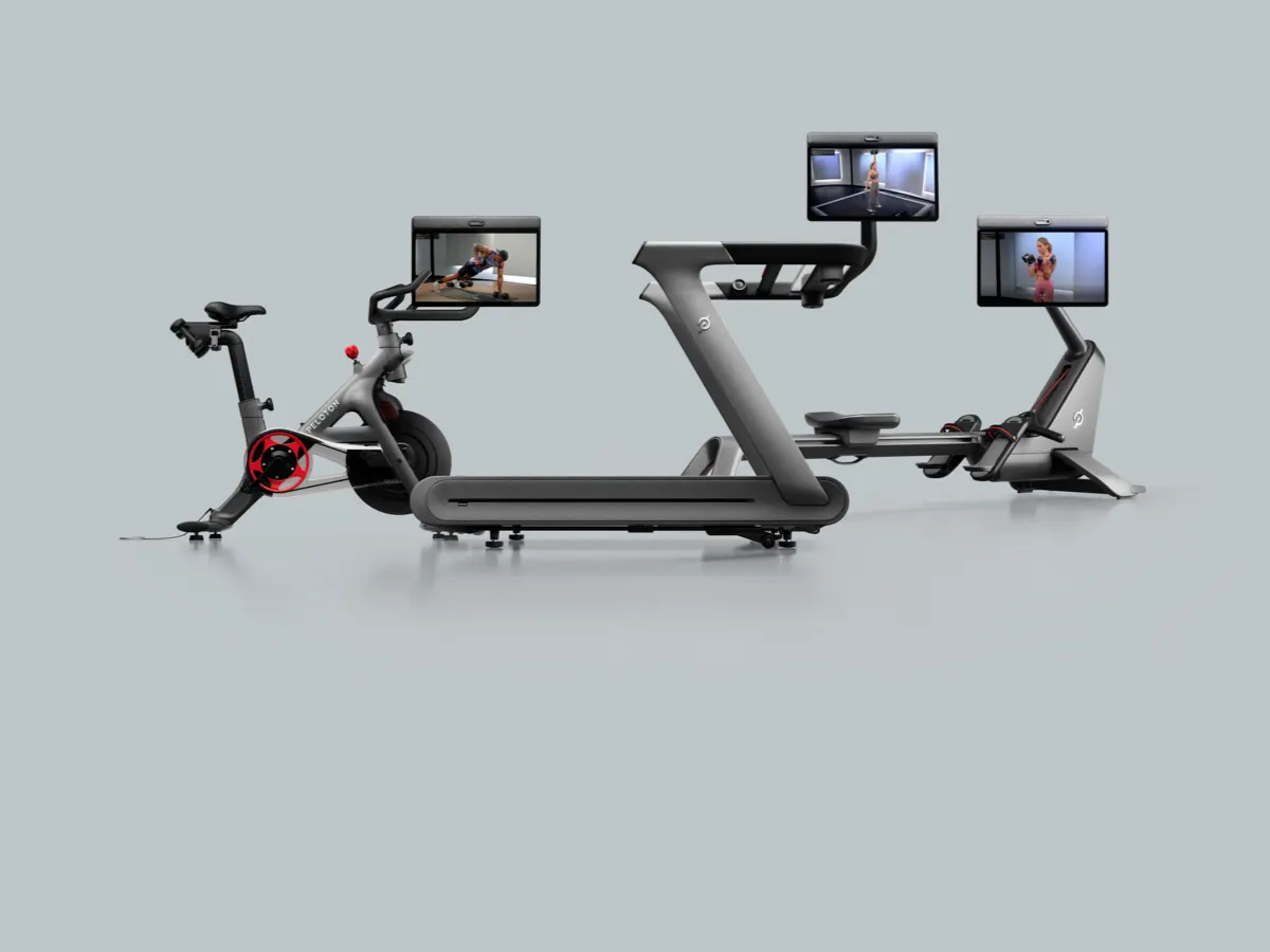 The Peloton Tread+ Pro, Bike+ Pro, and Row+ Pro on a white backdrop with their Swivel Screens rotated towards the viewer.