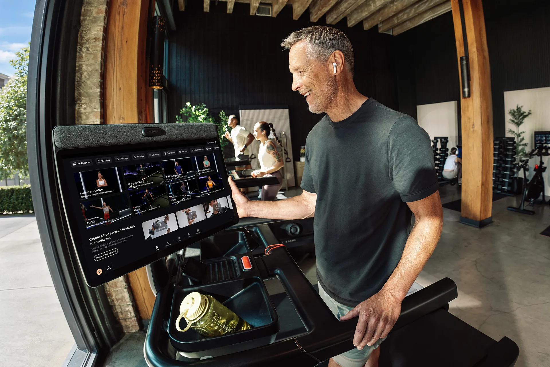 An exerciser selecting a class on a Peloton Commercial Tread