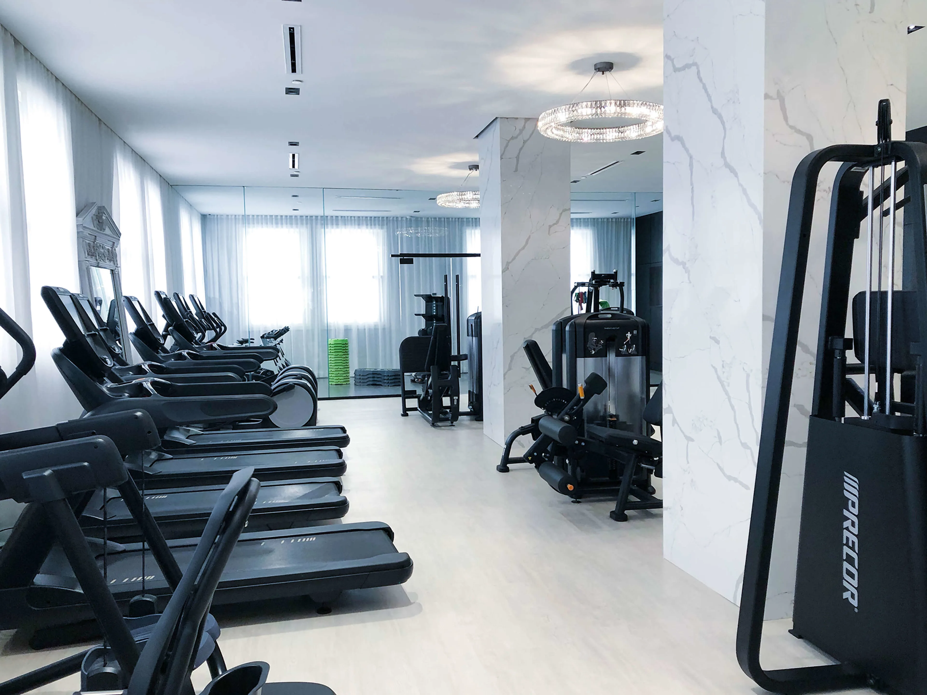 Exercise room full of cardio equipment
