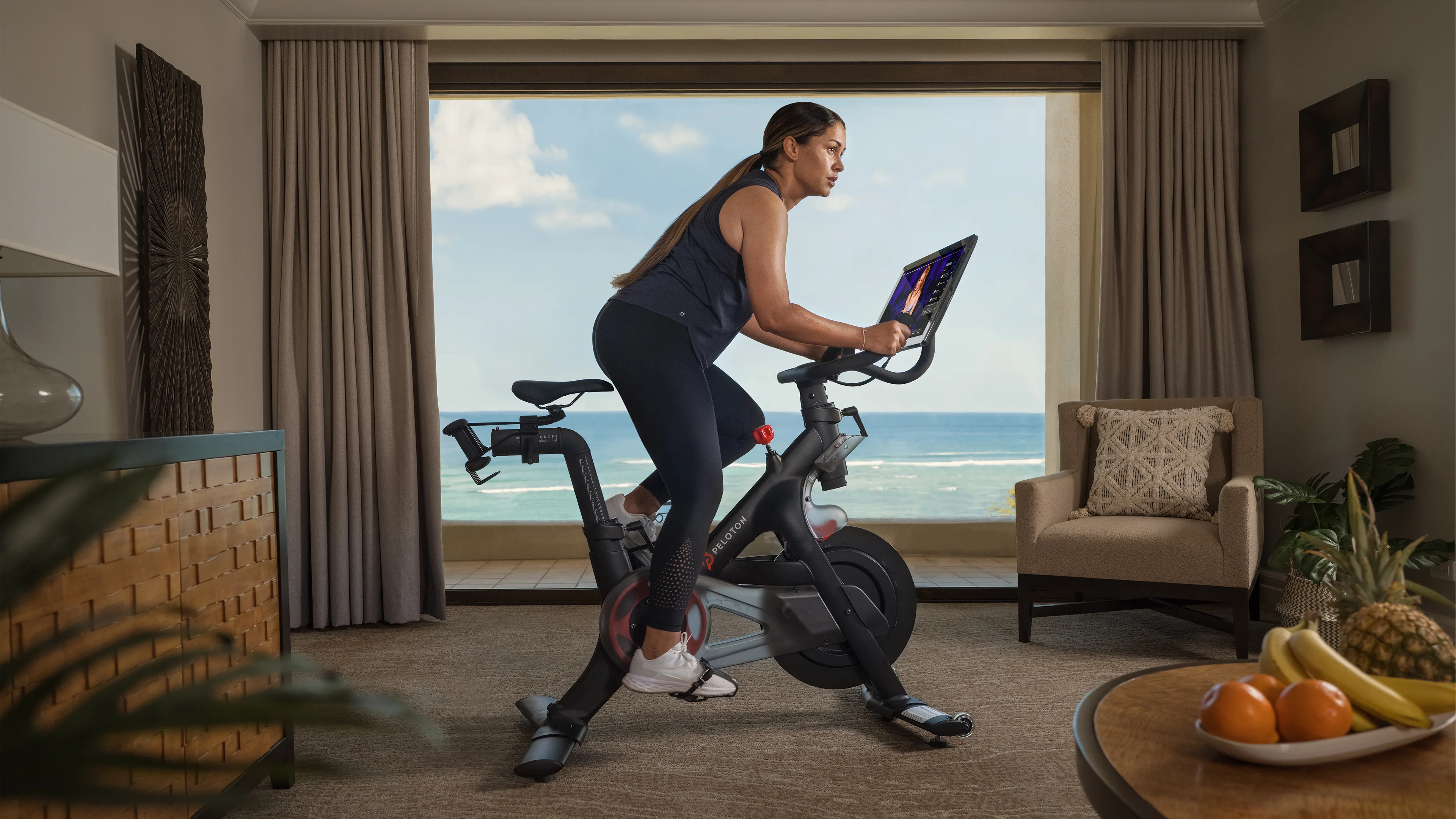 Hotel guest exercising on a Peloton Bike