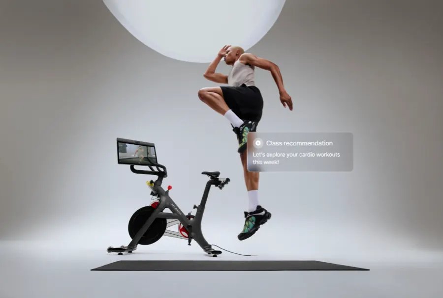 A person working out alongside Bike+ Pro, leaping into the air. An overlay on top says, "Class recommendation: Let's explore your cardio workouts this week!"