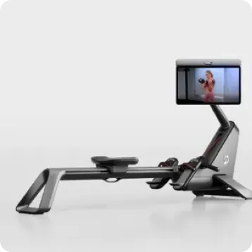 Peloton Row+ Pro, side angle, with the screen rotated toward the viewer