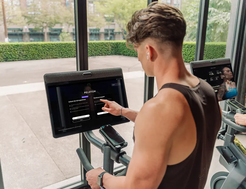 Person riding a commercial exercise bike