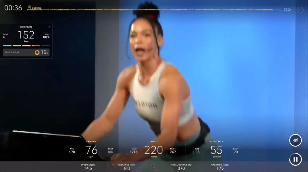 On-screen image of an instructor teaching a class with a user's stats at the bottom and side of the screen.