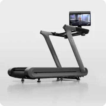 Peloton Tread+ Pro, side angle, with the screen rotated toward the viewer