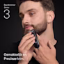 Jonge man trimt de baard op zijn kin met de Braun baardtrimmer Series 3 Jonge man trimt de baard op zijn kin met de Braun baardtrimmer Series 3
