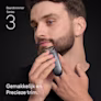 Jonge man trimt de baard op zijn kin met de Braun baardtrimmer Series 3 Jonge man trimt de baard op zijn kin met de Braun baardtrimmer Series 3