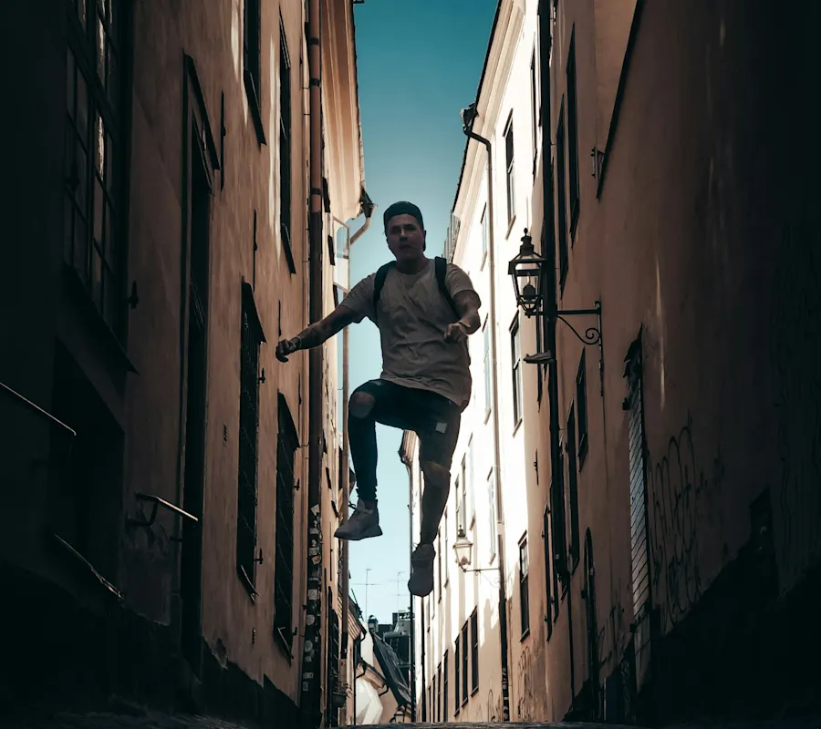 small Man jumping in alley in Gamla stan