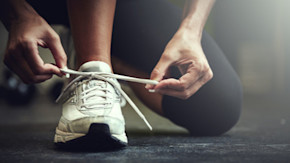 Person tying shoe
