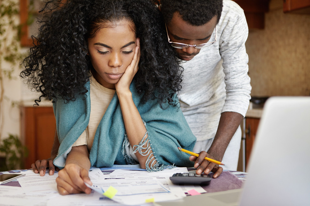 couple at a table going through bills together