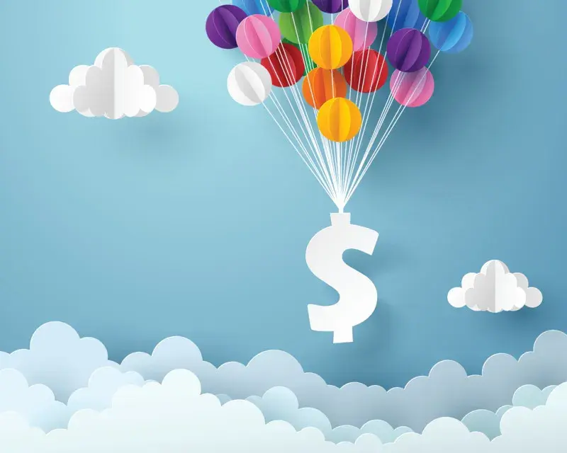 A dollar sign attached to balloons floating above the clouds.