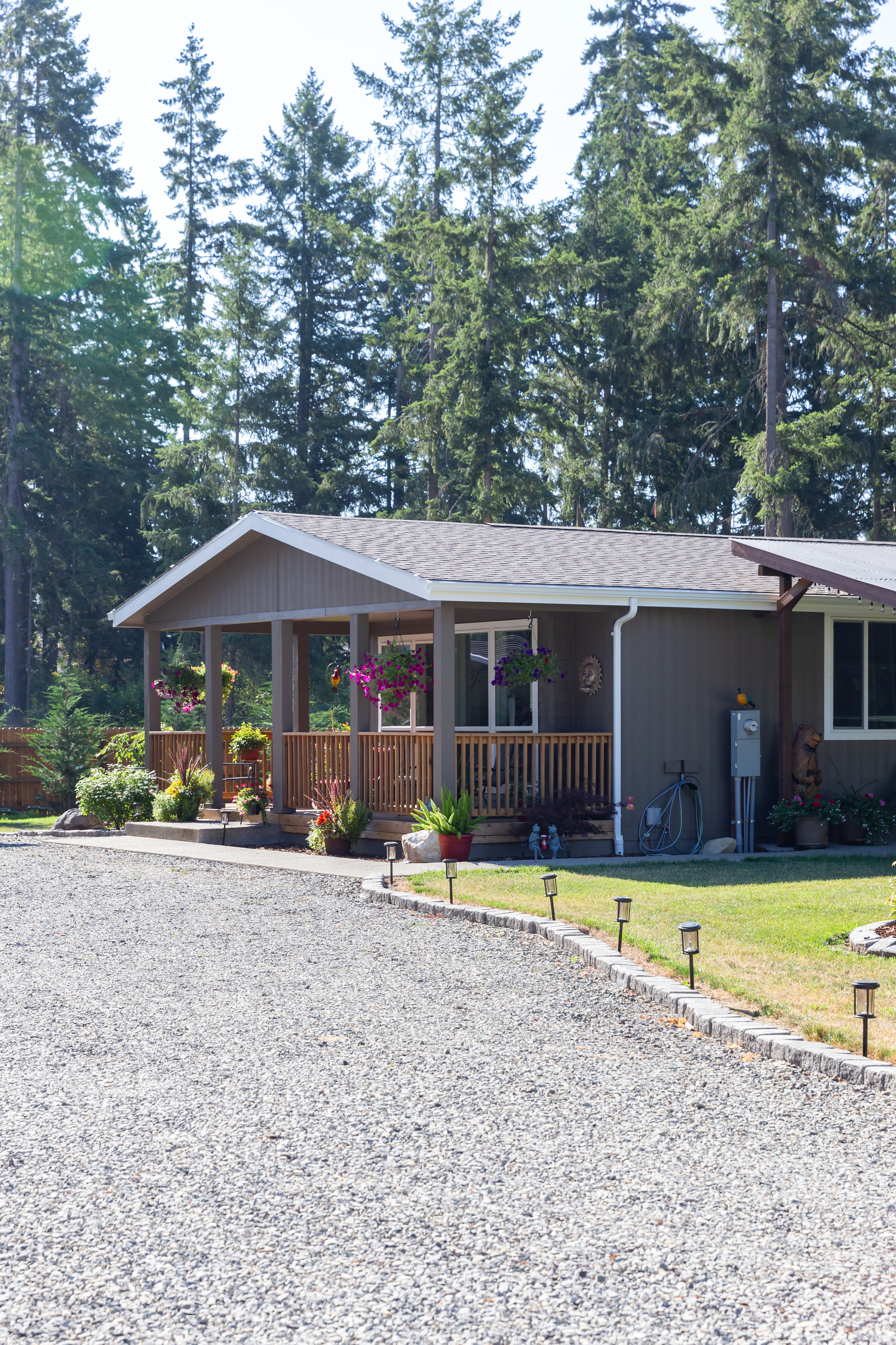 brown exterior home with a gravel driveway