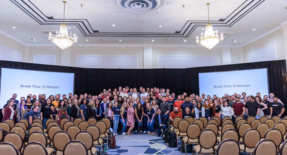 A group photo of participants in the Maverick Program posing during a break in the presentation.