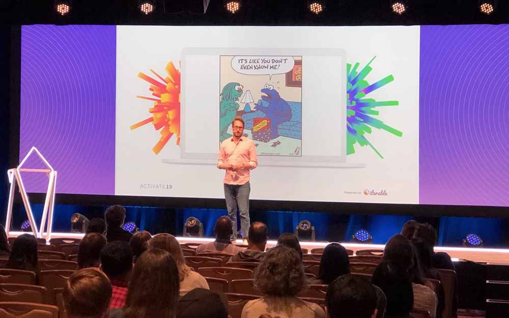 A picture of Patrick Butler giving a presentation in front of an audience.