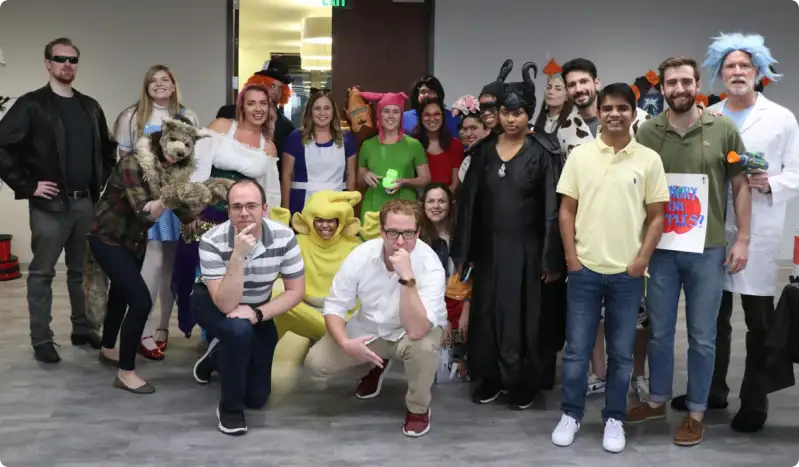 A picture of the Mailgun team dressed up in unique outfits and costumes.