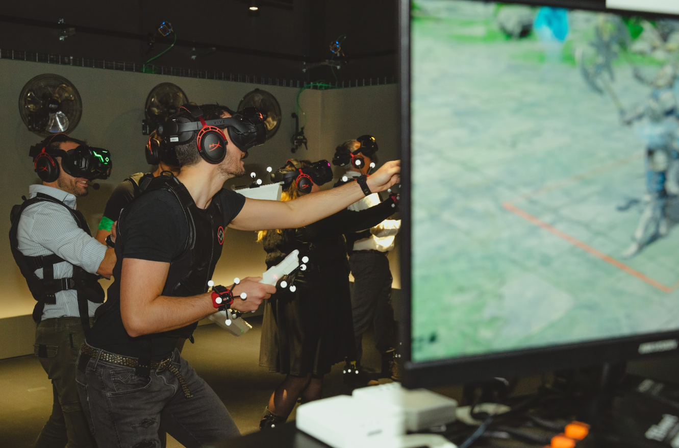 Corporate group in full-body VR gear playing a fully immersive VR experience.