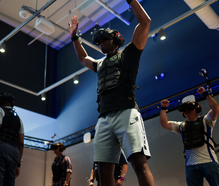 Guests actively playing in a VR experience.