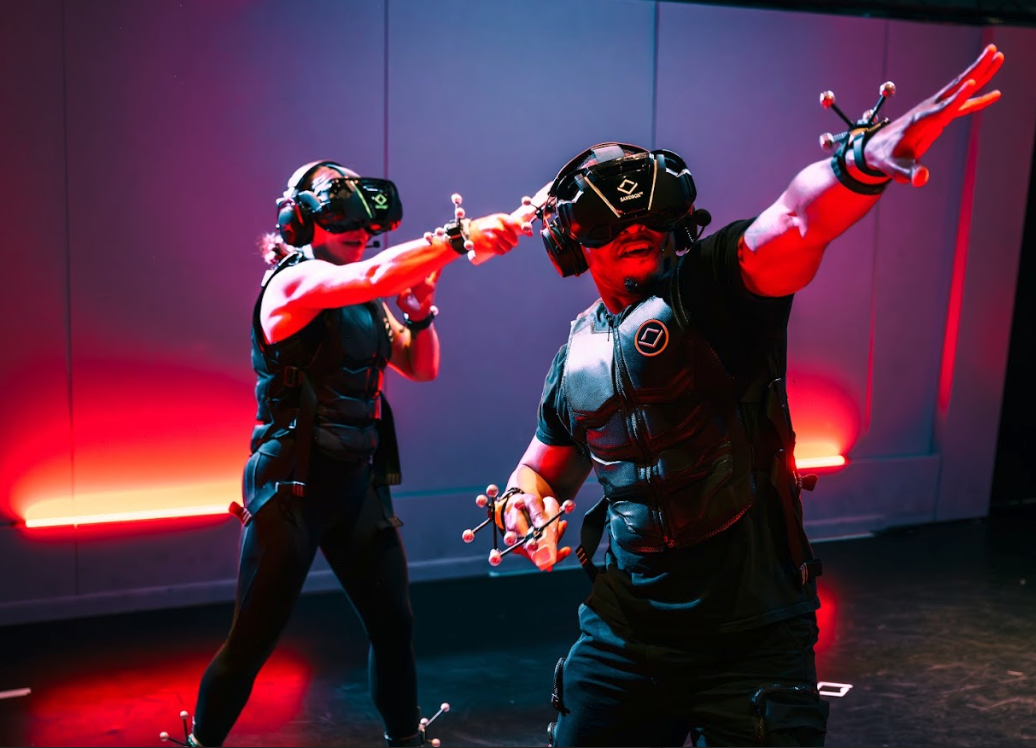 Couple action shot while playing VR. 