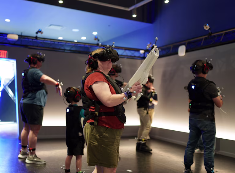 Mom and sons playing a VR experience