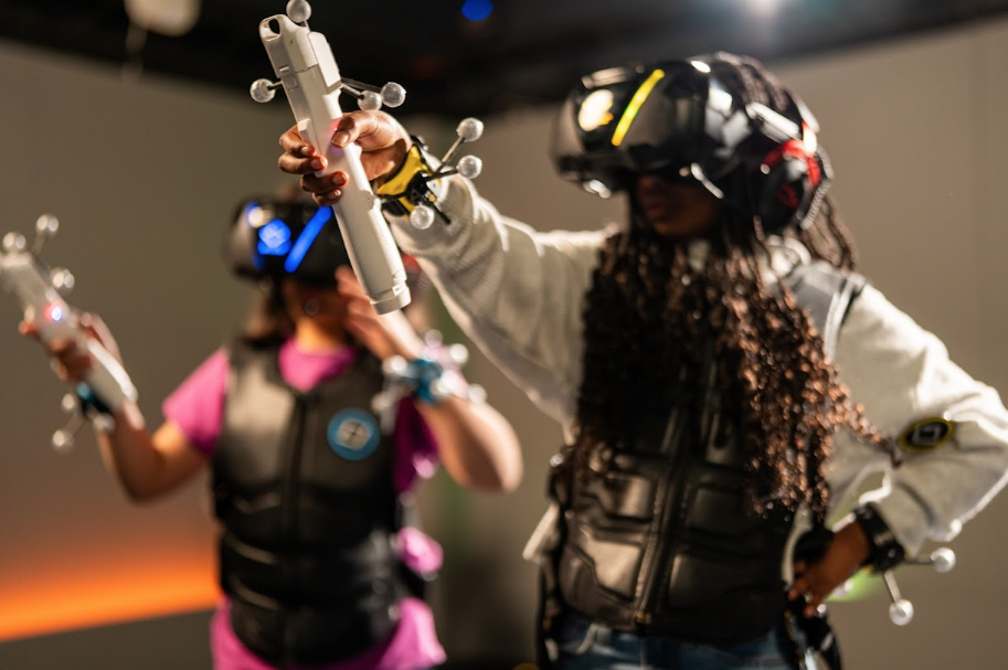 Kid playing Age of Dinosaurs all geared up