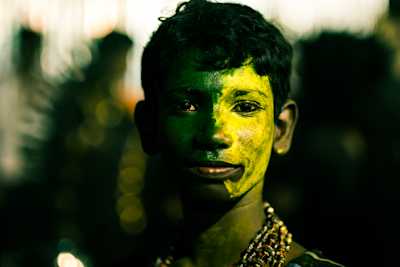 Shot during Kulasai Dassara festival celebrations in Kulasekarapattinam in Tamil Nadu. People dress up as gods and devils, this kid has both, one on each side, aren't we all the same?