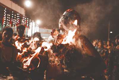 Shot during Kulasai Dassara festival celebrations in Kulasekarapattinam in Tamil Nadu. A man dancing with two lit wooden logs.
