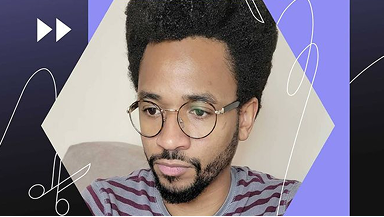 A man wearing round glasses against a purple graphic background with abstract line details