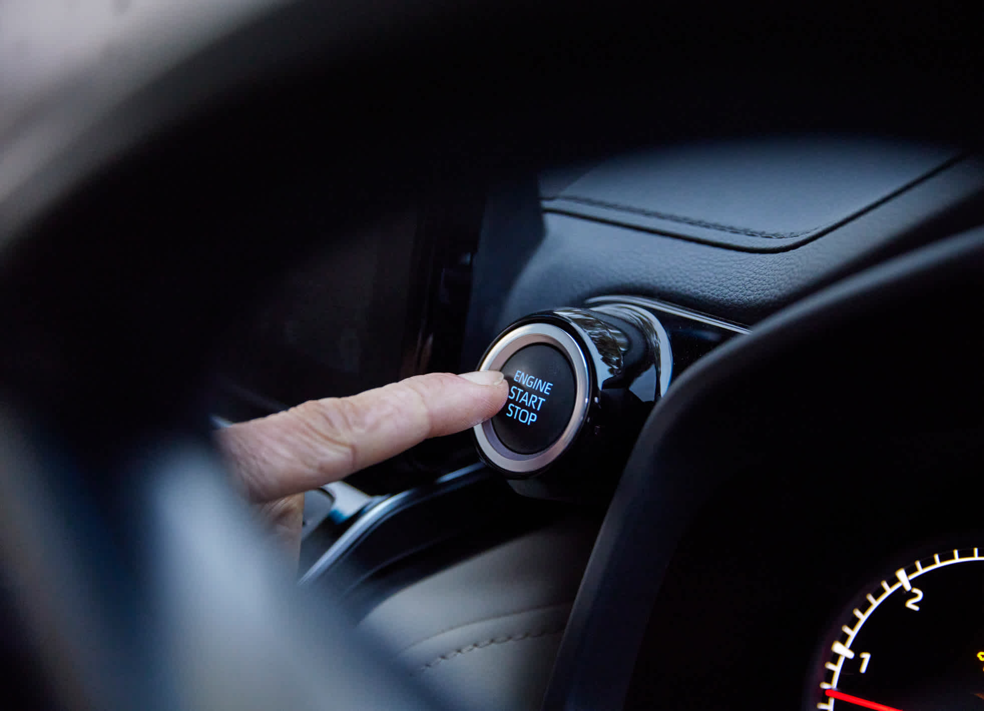 Pushing the start button of a vehicle