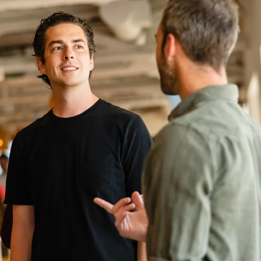 Image of two people talking