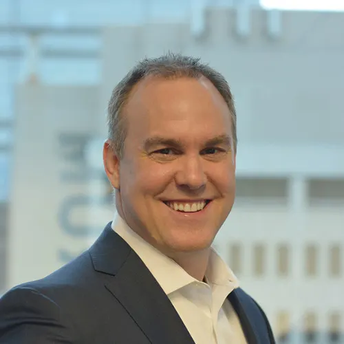 Headshot of Chris Bacon, Director of Finance at Veerum.